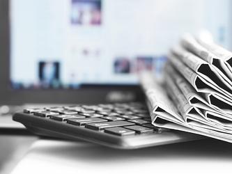 tradition newspaper with modern tech